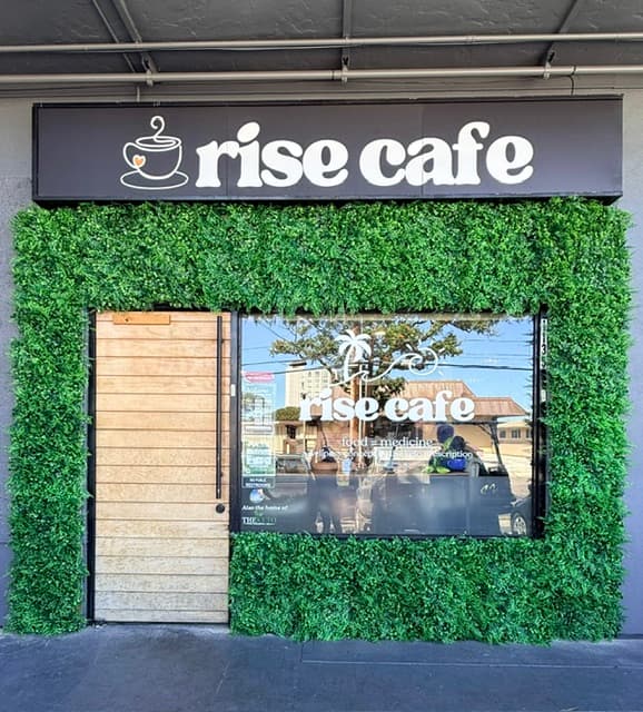 Cozy café corner with tables, chairs, and wall art featuring food images